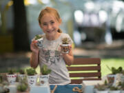 Emily Corsen, now 12 years old, shows off her succulents for sale during the Vancouver Farmers Market's kid market in 2019. The market has now partnered with the Greater Vancouver Chamber to provide free booths for young entrepreneurs and training to create and implement a business plan.