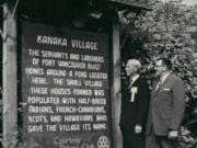 On the right, Kenneth Teter, once a Vancouver city councilman (1956-1963), stands beside an unidentified man examining an unfortunately worded sign (from today's perspective) donated by the Rotary Club describing the Hudson's Bay Company employees' village that once stood outside Fort Vancouver.