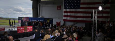 President Joe Biden looks to a crowd at a Portland Air National Guard hangar while speaking about his administration's $1.2 trillion infrastructure legislation signed in November. He noted how the federal funding would be invested in Oregon's airport, roads and bridges.