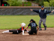 An umpire calls Battle Ground's Hailey Ferguson safe on a stolen base, as she beat the tag of Skyview's Kya Jenkins in a 4A Greater St. Helens League softball game on Friday, April 29, 2022, at Battle Ground High School. Skyview beat Battle Ground 2-0.