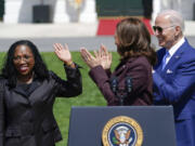 President Joe Biden and Vice President Kamala Harris applaud Judge Ketanji Brown Jackson as Harris speaks during an event on the South Lawn of the White House in Washington, Friday, April 8, 2022, celebrating the confirmation of Jackson as the first Black woman to reach the Supreme Court.