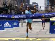 Peres Jepchirchir, of Kenya, crosses the finish line to win the women's division of the 126th Boston Marathon, Monday, April 18, 2022, in Boston.