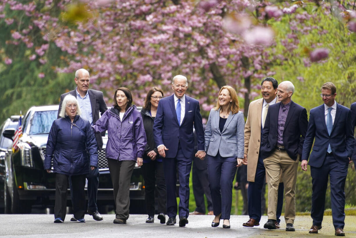 President Joe Biden arrives to speak at Seward Park on Earth Day, Friday, April 22, 2022, in Seattle. From left, Sen. Patty Murray, D-Wash., Rep. Rick Larsen, D-Wash., Sen. Maria Cantwell, D-Wash., Rep. Suzan DelBene, D-Wash., Biden, Rep. Kim Schrier, D-Wash., Seattle Mayor Bruce Harrell, Rep. Adam Smith, D-Wash., and Rep. Derek Kilmer, D-Wash.