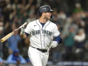 Seattle Mariners' Ty France flips his bat after hitting a three-run home run that scored Julio Rodriguez and Jesse Winker off of Kansas City Royals relief pitcher Dylan Coleman during the eighth inning of a baseball game, Saturday, April 23, 2022, in Seattle. The Mariners won 13-7.