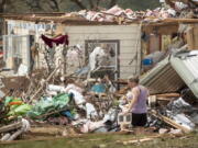 Michelle Light salvages belongings from her home on FM 2843 and Cedar Valley Road near Salado, Texas, on Wednesday, April 13, 2022, a day after a tornado destroyed the house.