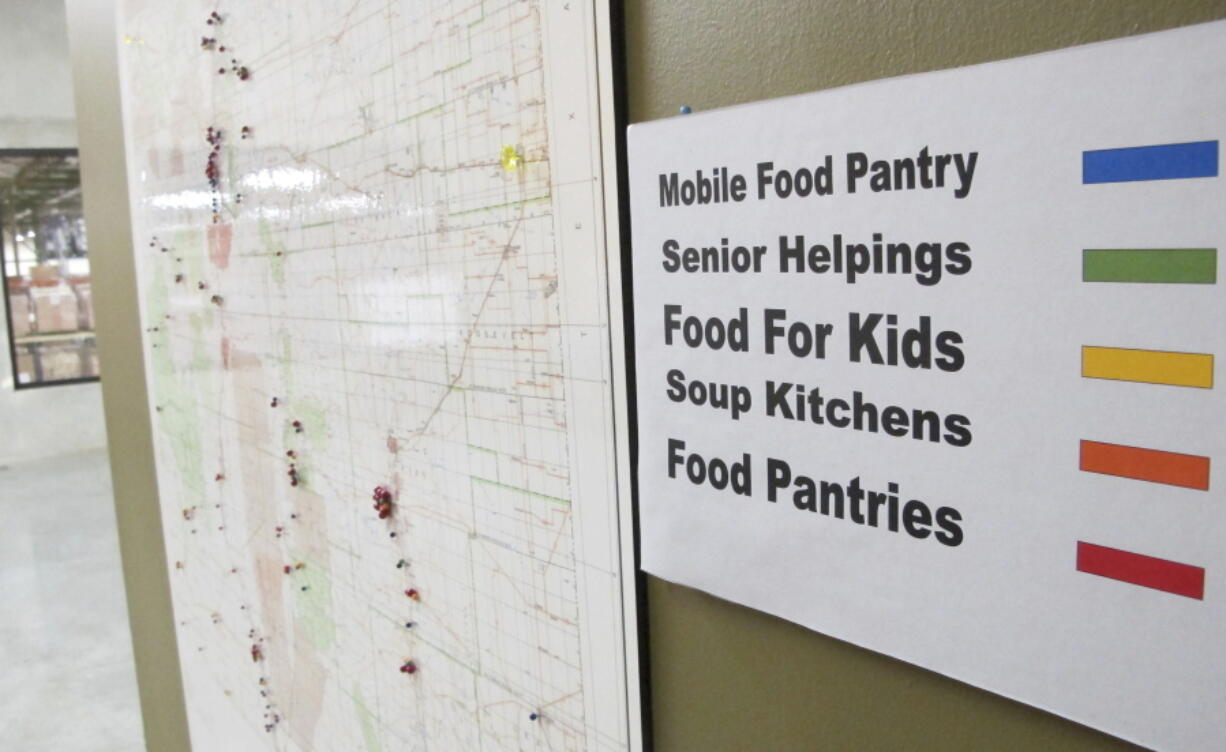 FILE - This June 21, 2013 image shows a map at Roadrunner Food Bank in Albuquerque, N.M., that depicts food distribution points across New Mexico. States with some of the nation's strictest abortion laws are also some of the hardest places to have and raise a healthy child, especially for the poor, according to an analysis of federal data by The Associated Press. A weaker safety net pattern isn't consistent for all measurements, with some Democratically controlled states, like New Mexico, that have less restrictive abortion laws also measuring poorly in some categories.