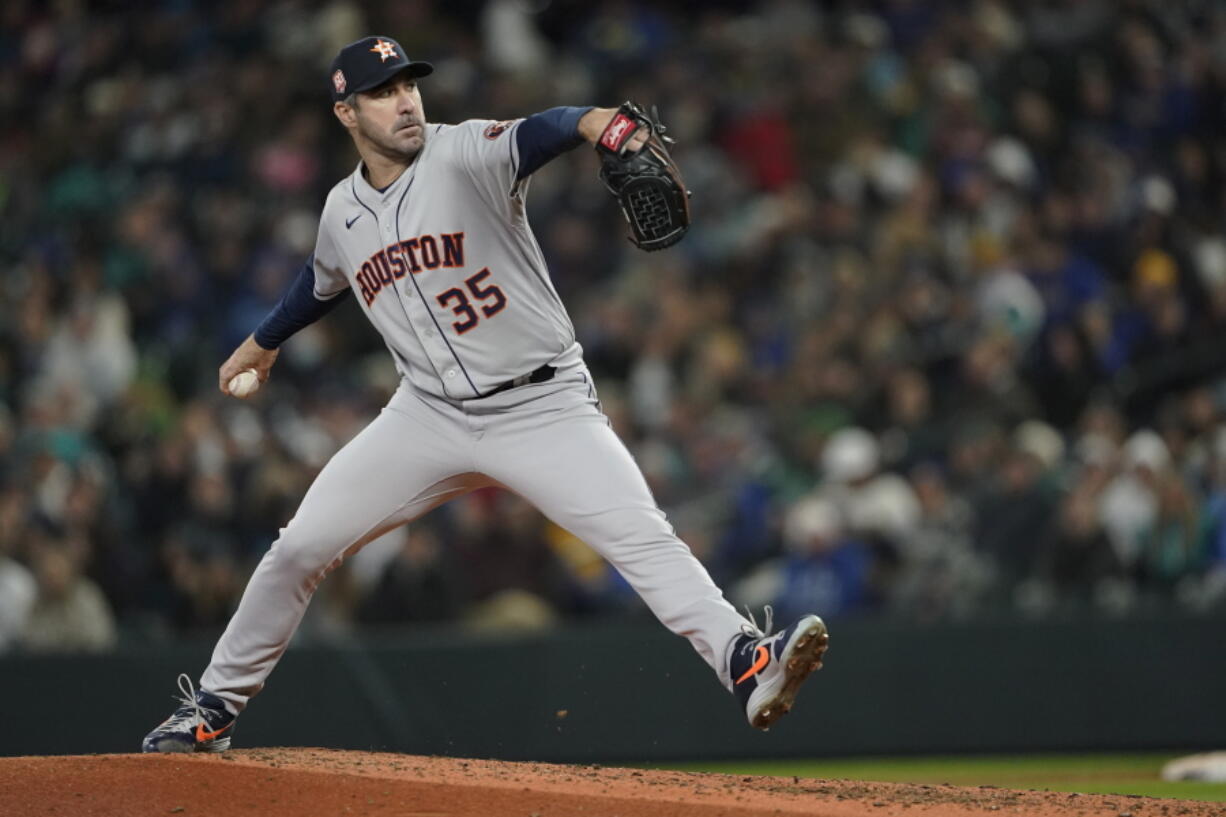 Houston Astros starting pitcher Justin Verlander throws against the Seattle Mariners during the sixth inning of a baseball game, Saturday, April 16, 2022, in Seattle. (AP Photo/Ted S.