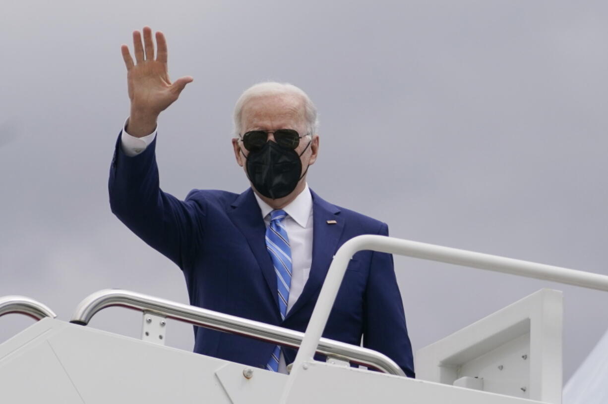 President Joe Biden boards Air Force One in Andrews Air Force Base, Md., Tuesday, April 12, 2022, en route to Menlo, Iowa.