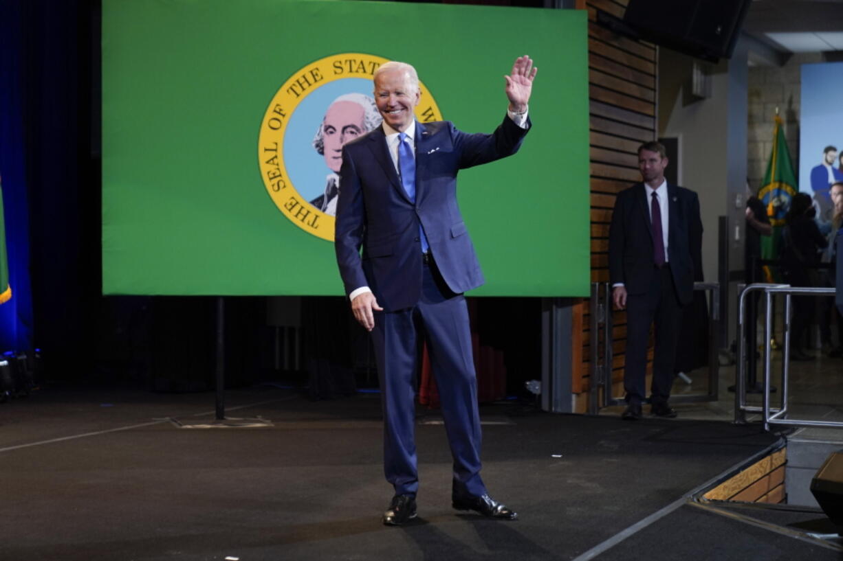 President Joe Biden waves as he leaves after speaking at Green River College, Friday, April 22, 2022, in Auburn, Wash.