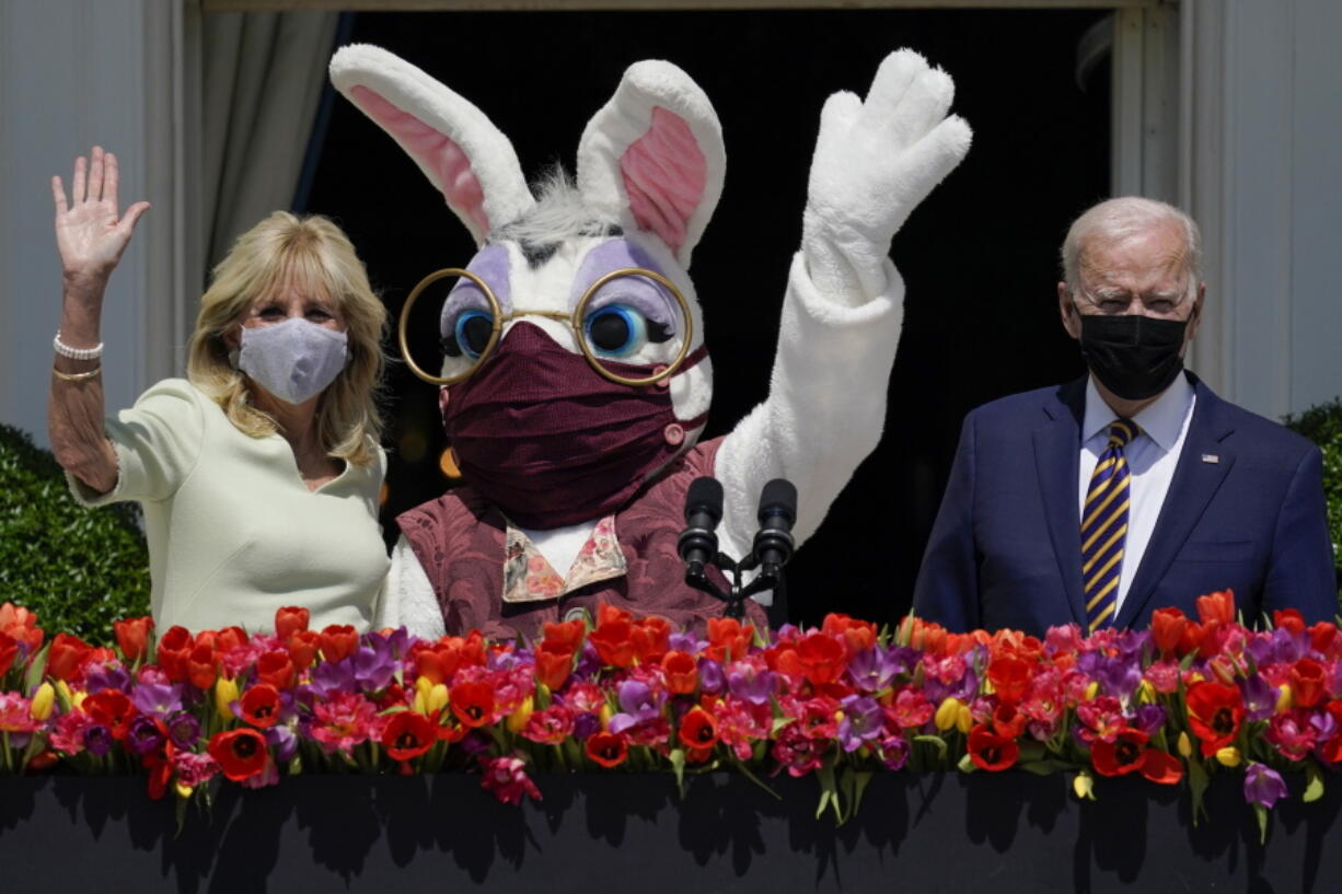 FILE - President Joe Biden appears with first lady Jill Biden and the Easter Bunny on the Blue Room balcony at the White House April 5, 2021, in Washington. The White House Easter Egg Roll is returning on April 18, 2022, after a 2-year, COVID-induced hiatus. The Biden's will welcome some 30,000 kids and their adult chaperones for the egg roll, an egg hunt and other activities.