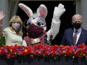 FILE - President Joe Biden appears with first lady Jill Biden and the Easter Bunny on the Blue Room balcony at the White House April 5, 2021, in Washington. The White House Easter Egg Roll is returning on April 18, 2022, after a 2-year, COVID-induced hiatus. The Biden's will welcome some 30,000 kids and their adult chaperones for the egg roll, an egg hunt and other activities.