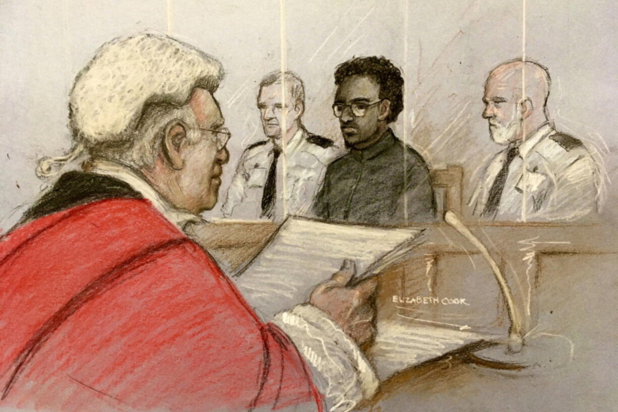 This court artist sketch by Elizabeth Cook shows Justice Nigel Sweeney, left, handing down a whole life sentence to Ali Harbi Ali, second from right, at the Old Bailey in London, Wednesday April 13, 2022. An Islamic State supporter, Ali Harbi Ali, was given a whole-life sentence Wednesday for stabbing British lawmaker David Amess to death in October 2021 in revenge for his voting in support for airstrikes on Syria.