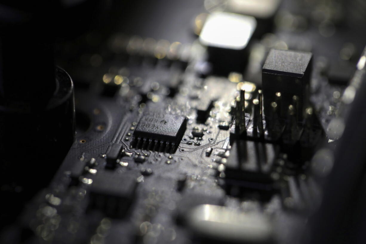 FILE - The inside of a computer is seen on Feb 23, 2019, in Jersey City, N.J. A global computer chip shortage has made it harder for consumers to get their hands on cars, computers and other modern-day necessities, so Congress is looking to boost chip manufacturing and research in the United States with billions of dollars from the federal government.