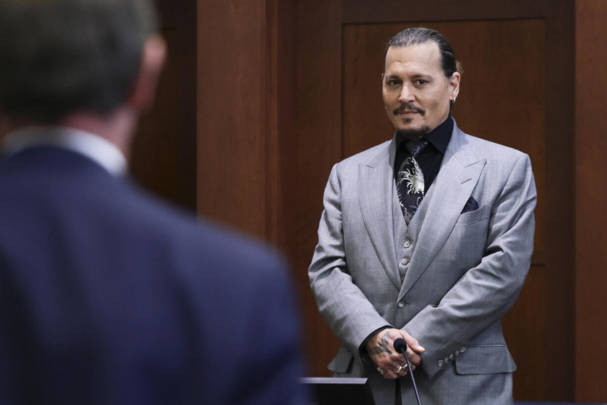 Actor Johnny Depp looks on at the end of the second day of his testimony in the courtroom at the Fairfax County Circuit Court in Fairfax, Va., Wednesday, April 20, 2022.