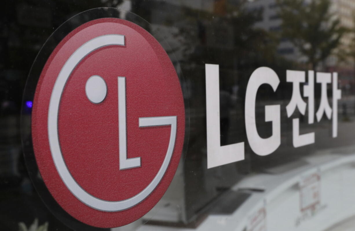 FILE - This Oct. 26, 2017 file photo shows the corporate logo of LG Electronics in Goyang, South Korea.  U.S. safety regulators have opened an investigation into electric and hybrid vehicle batteries, Tuesday, April 5, 2022,  after seven automakers issued recalls for defects that can cause fires or stalling.