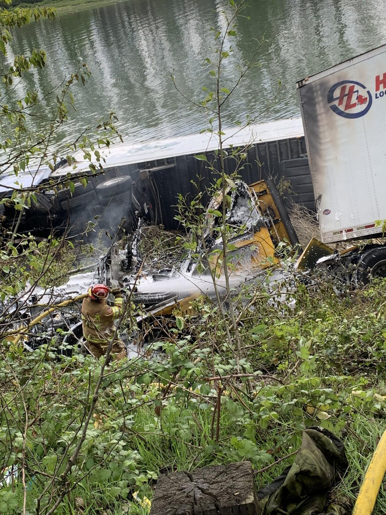 One semi ended up in the river and another was on fire after a crash on I-5 southbound near Woodland.