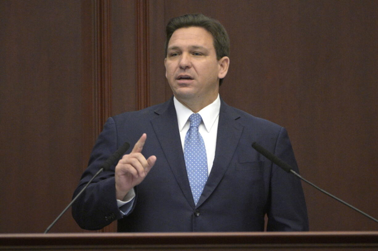 FILE - Florida Gov. Ron DeSantis addresses a joint session of a legislative session, Jan. 11, 2022, in Tallahassee, Fla.   (AP Photo/Phelan M.