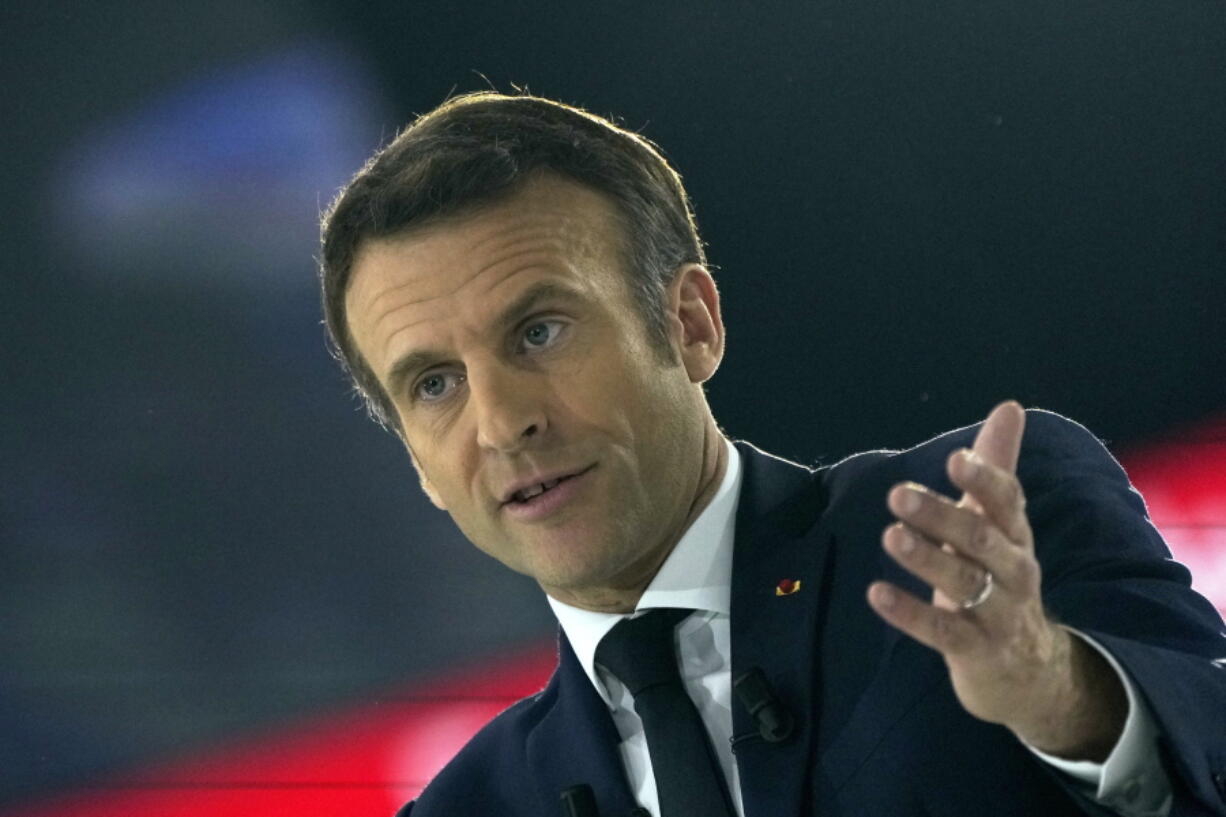 French President Emmanuel Macron and centrist candidate for reelection delivers his speech during a meeting in Paris, Saturday, April 2, 2022. France's first round of the presidential election will take place on April 10, with a presidential runoff on April 24 if no candidate wins outright.