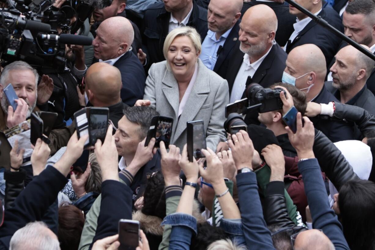 French far-right leader and presidential candidate Marine Le Pen campaigns, Monday, April 18, 2022 in Saint-Pierre-en-Auge, Normandy. French President Emmanuel Macron is facing off against far-right challenger Marine Le Pen in France's April 24 presidential runoff.