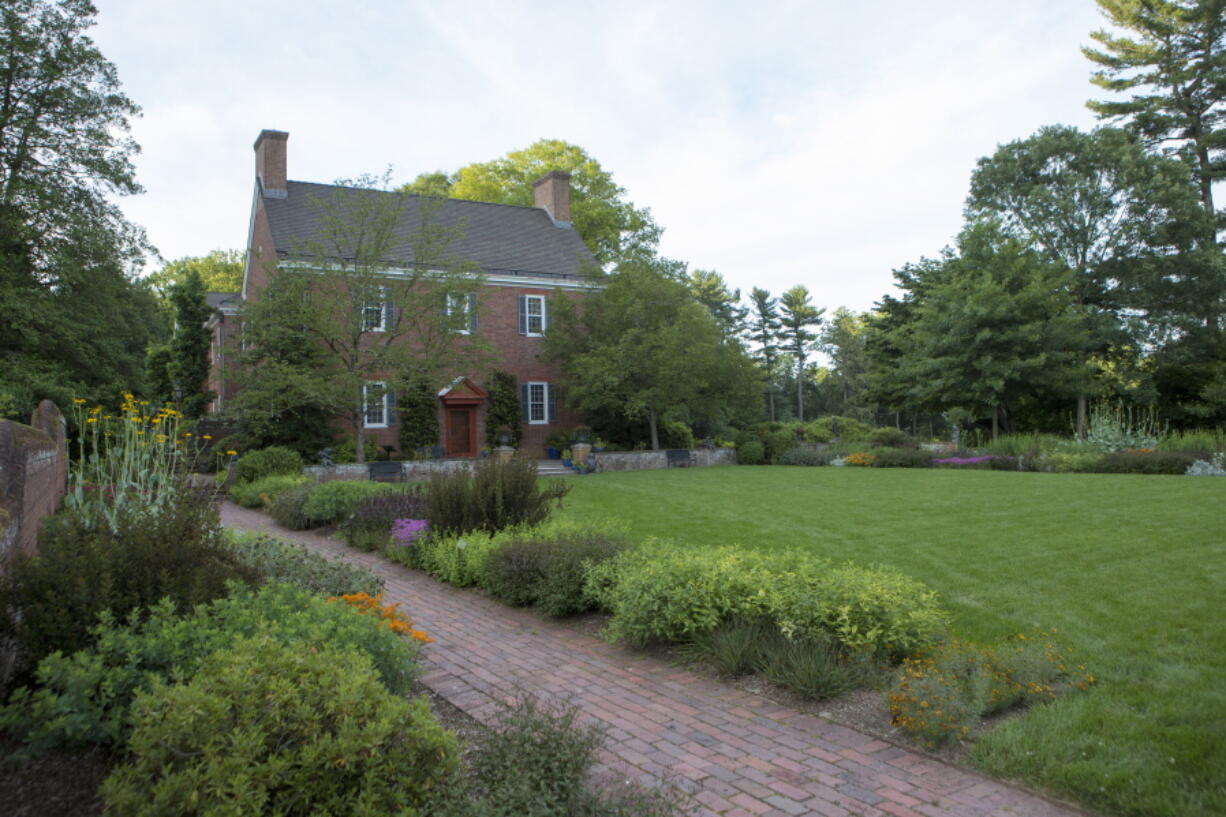 This image provided by Mt. Cuba Center shows the formal native plant garden blooming at the botanical garden, located in Hockessin, Del. Plantings depicted are: Amsonia tabernaemontana 'Storm Cloud', Asclepias tuberosa, Coreopsis verticillata 'Crazy Cayenne', Gillenia trifoliata 'Pink Profusion', Monarda didyma 'AChall', Penstemon 'Dark Towers', Physocarpus opulifolius 'SMPOTW', Rudbeckia maxima, Sisyrinchium angustifolium 'Lucerne', Solidago sphacelata 'Golden Fleece' and Symphyotrichum oblongifolium 'October Skies'. (Alessandra N. Stokley/Mt. Cuba Center via AP) (Debbie Roos/N.C.