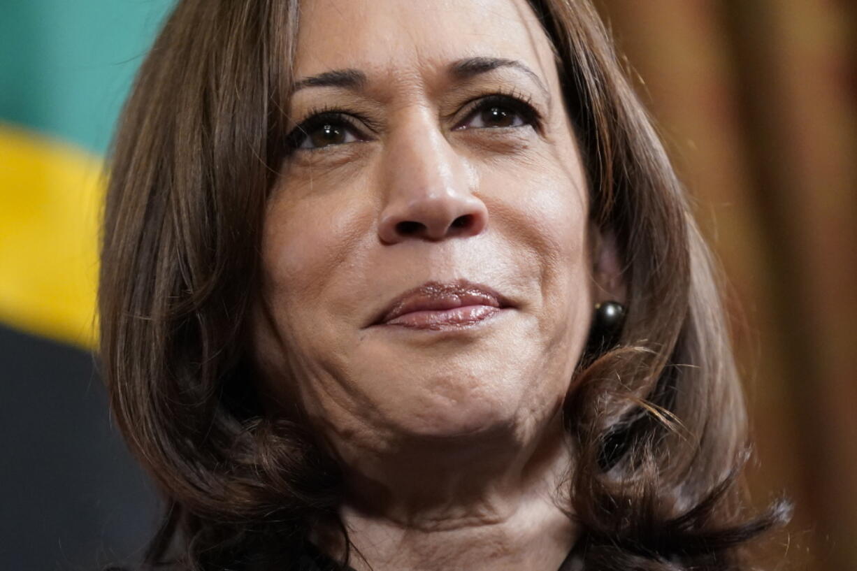 FILE - Vice President Kamala Harris meets with Tanzanian President Samia Suluhu Hassan in Harris' ceremonial office in the Eisenhower Executive Office Building on the White House campus, April 15, 2022, in Washington. Harris tested positive for COVID-19 on Tuesday, the White House announced, underscoring the persistence of the highly contagious virus even as the U.S. eases restrictions in a bid to revert to pre-pandemic normalcy.