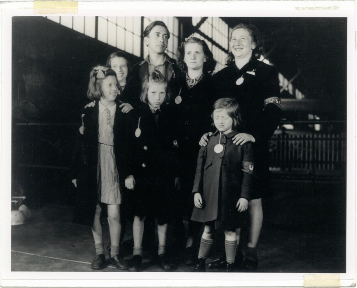 In this May 26, 1946, photo, Ginger Lane, bottom right, and her siblings arrive in New York City as Holocaust survivors who were hidden in a fruit orchard near Berlin by non-Jews. Their mother was killed at the death camp at Auschwitz. Lane has since made it her lifelong mission to educate others of this painful past.