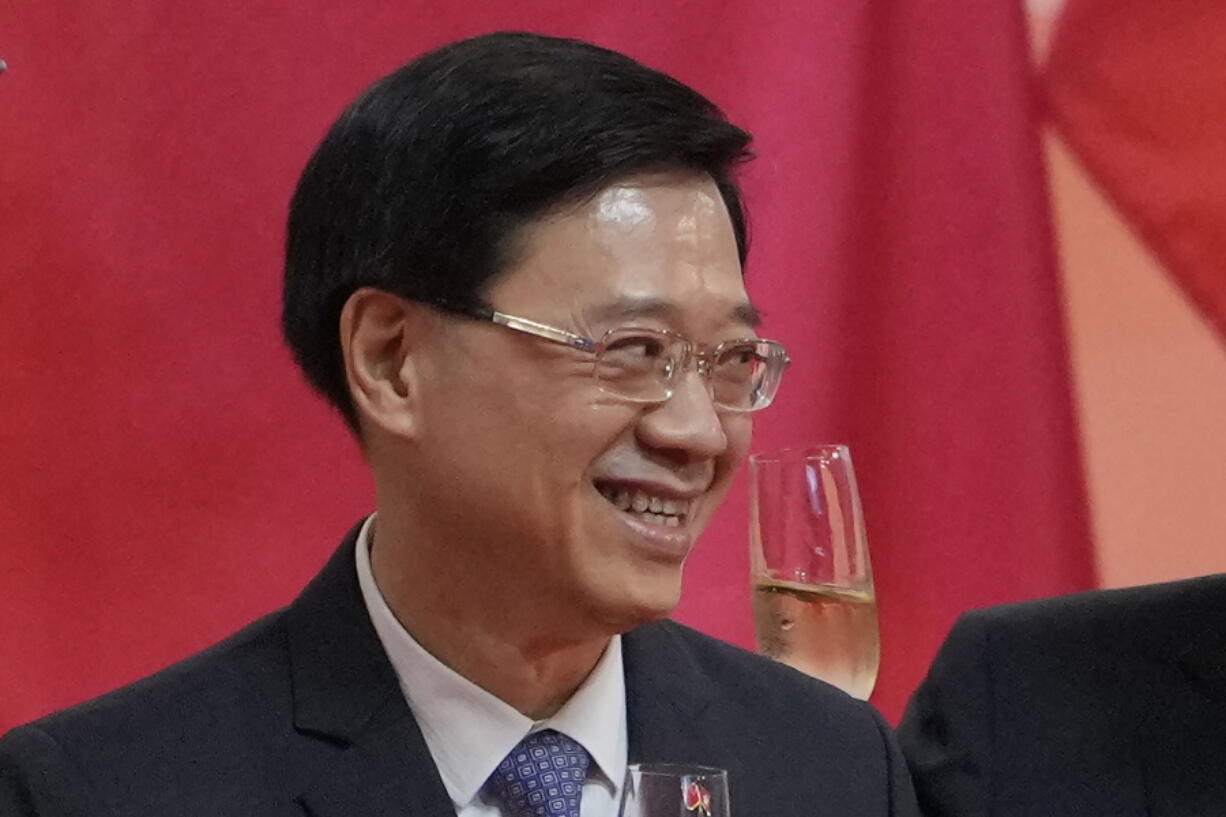 Hong Kong's Chief Secretary John Lee attends a reception, following the flag-raising ceremony for the celebration of 24th anniversary of Hong Kong handover to China, in Hong Kong, Thursday, July 1, 2021. After Hong Kong leader Carrie Lam announced she would not seek a second term, local media says that her No. 2 John Lee is likely to enter the race to succeed her. Chief Secretary Lee was the city's head of security during the protests.