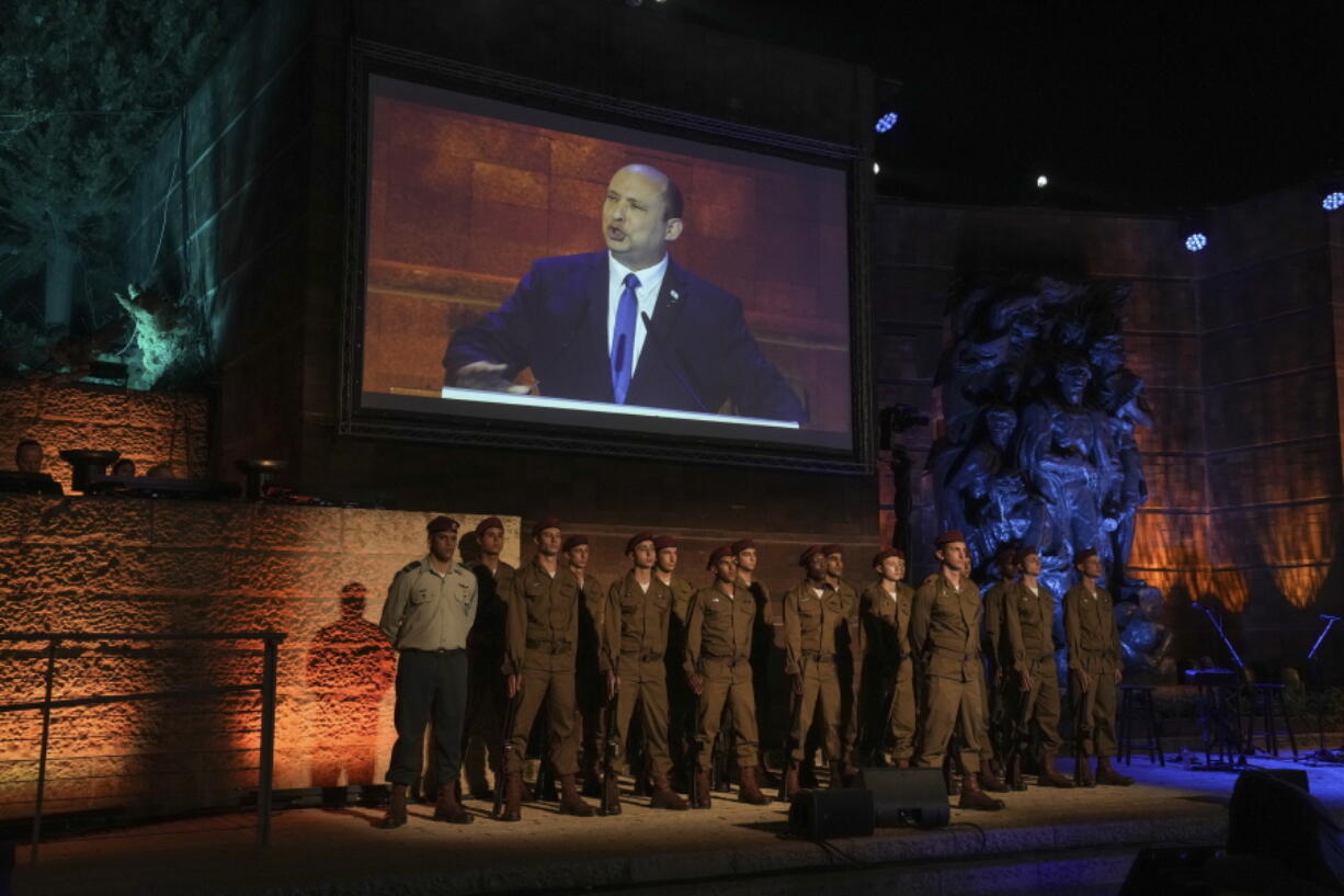 Israeli Prime Minister Naftali Bennett delivers a speech during the opening ceremony of the Holocaust Martyrs and Heroes Remembrance Day at Yad Vashem Holocaust Museum in Jerusalem, Wednesday, April 27, 2022. Bennett opened the country's Holocaust memorial day Wednesday with a stark warning for Jews against letting internal divisions tear society apart.