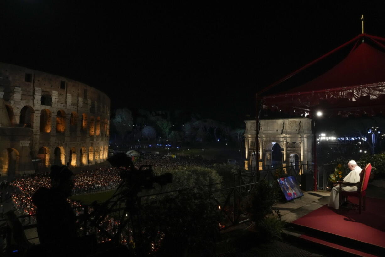 Pope Francis presides over the Via Crucis (Way of the Cross) torchlight procession on Good Friday in front of Rome's Colosseum, in Rome, Friday, April 15, 2022.