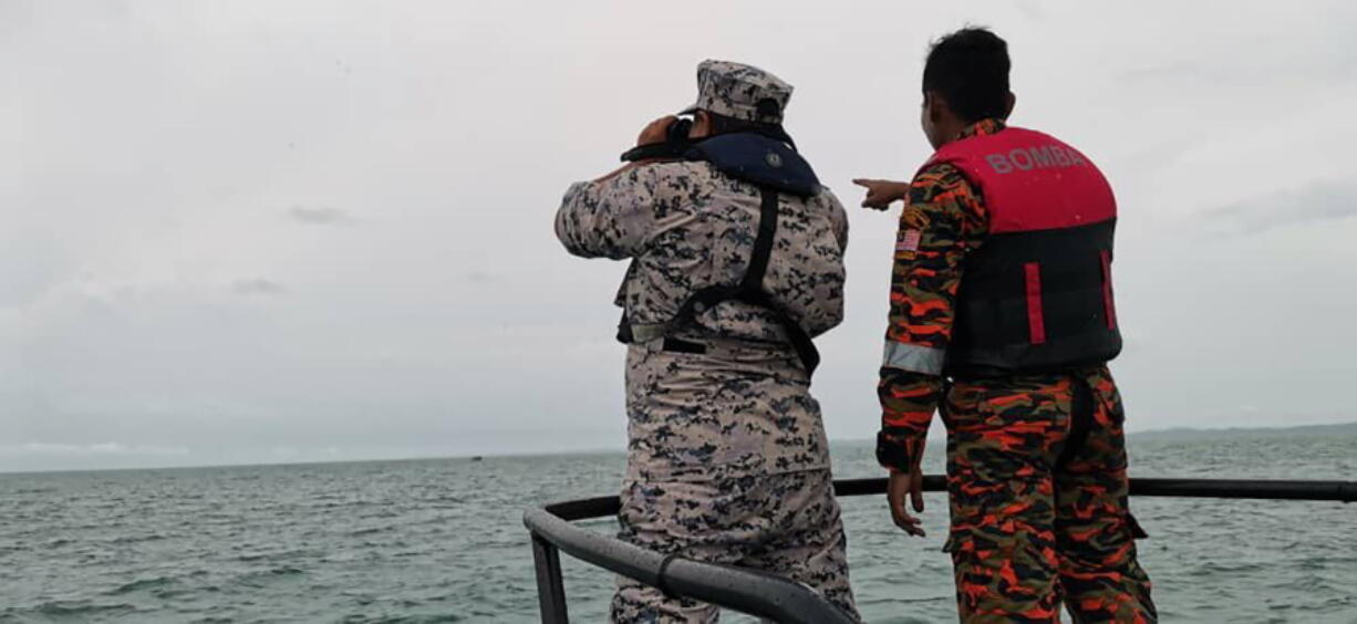 This photo released by Malaysian Maritime Enforcement Agency (MMEA) shows search and rescue operation for four foreign divers off the coast of Johor's Mersing, Malaysia Friday, April 8, 2022.