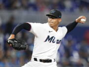 Miami Marlins' Jesus Luzardo delivers a pitch during the first inning of a baseball game against the Seattle Mariners, Saturday, April 30, 2022, in Miami.