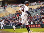 Minnesota Twins' Gary Sanchez (24) rounds to home base after hitting a grand slam against the Seattle Mariners during the first inning of a baseball game, Sunday, April 10, 2022, in Minneapolis.