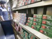 FILE - This May 17, 2018 file photo shows packs of menthol cigarettes and other tobacco products at a store in San Francisco.   As federal officials finalize a long-awaited plan to ban menthol cigarettes, dozens of interest groups have met with White House staffers to try and influence the process, which has the potential to save thousands of lives while wiping out billions in tobacco sales.