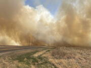 This image provided by the Nebraska State Patrol shows smoke from a wildfire, Saturday, April 23, 2022 near Cambridge, Neb. Several small towns, including Cambridge, Bartley, Indianola and Wilsonville, in Nebraska's southwest and Macy in its northeast, were forced to temporarily evacuate because of the wind-driven wildfires.