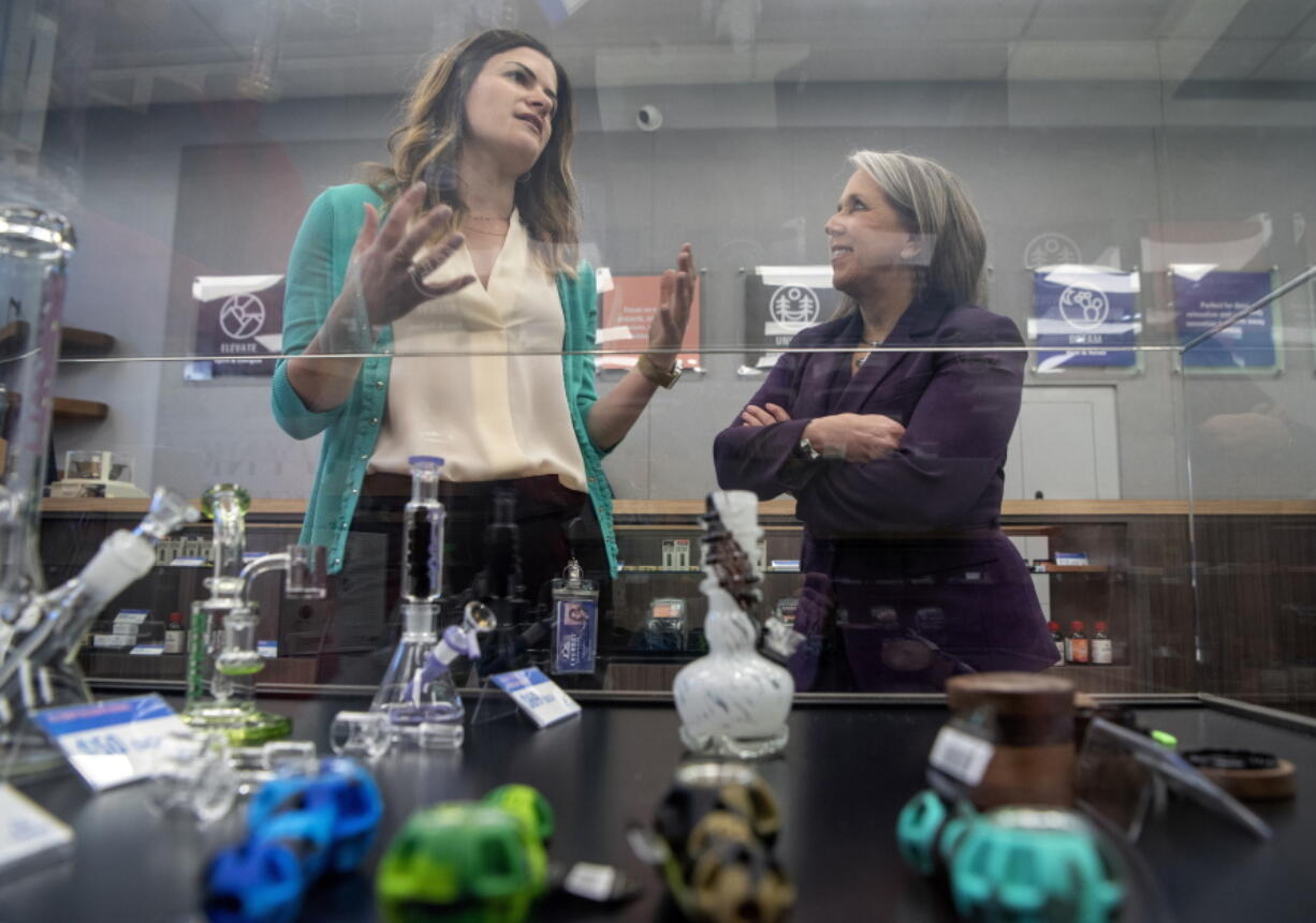 Gov. Michelle Lujan Grisham, right, takes a tour of the Everest Cannabis Co.-Uptown with CEO Trishelle Kirk on the first day of recreational cannabis sales, Friday April 1, 2022, Albuquerque.