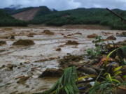 This photo provided by the Philippine Coast Guard, shows a landslide area at Baybay City, Leyte province, central Philippines Monday, April 11, 2022. Heavy rains caused by a summer tropical depression killed at least several people in the central and southern Philippines, mostly due to landslides, officials said Monday.