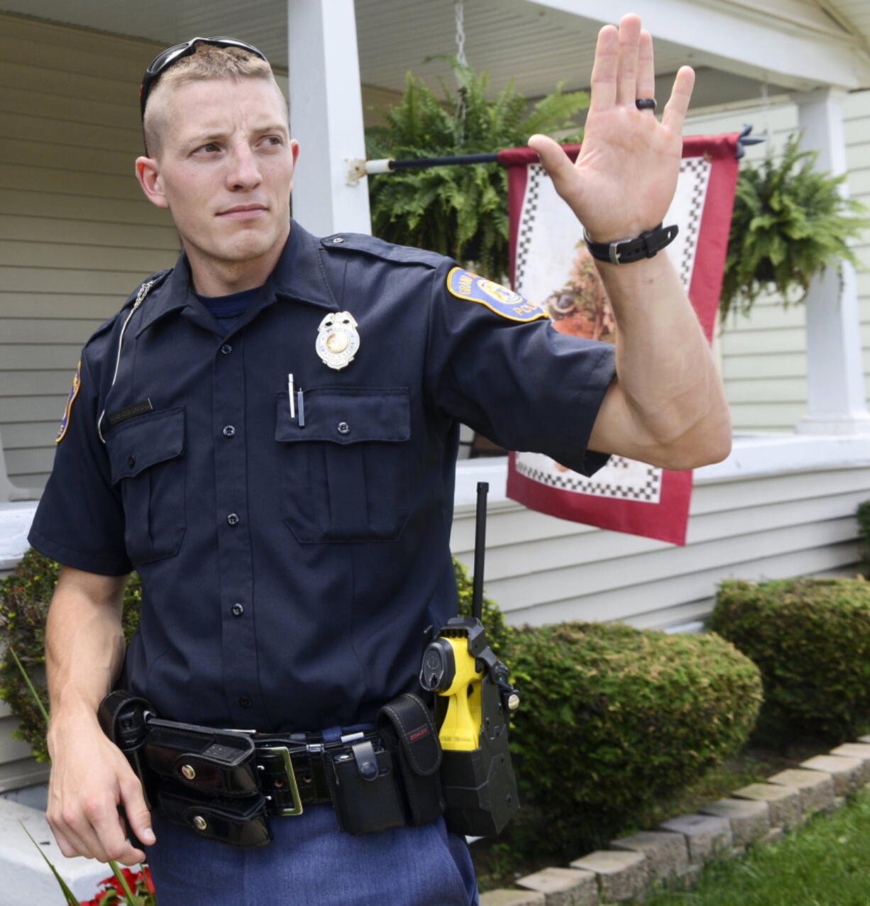 Grand Rapids Police Officer Christopher Schurr stops to talk with a resident, Wednesday, August 12, 2015, in Grand Rapids, Mich. Grand Rapids police have identified Schurr as the officer who killed Patrick Lyoya three weeks ago. Lyoya was a Black man and native of Congo who was fatally shot in the back of the head after a struggle with the officer. Police Chief Eric Winstrom had declined to name the officer but changed course Monday, April 25, 2022. He says he's doing it in the "interest of transparency" and to reduce speculation.