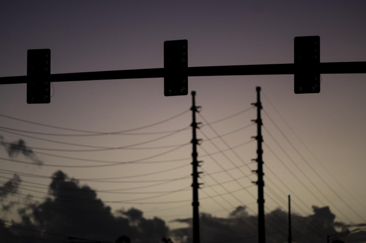 Traffic lights are out of service on a street in San Juan, Puerto Rico, early Thursday, April 7, 2022. More than a million customers in Puerto Rico remained without electricity on Thursday after a fire at a main power plant caused the biggest blackout so far this year across the U.S. territory, forcing it to cancel classes and shutter government offices.