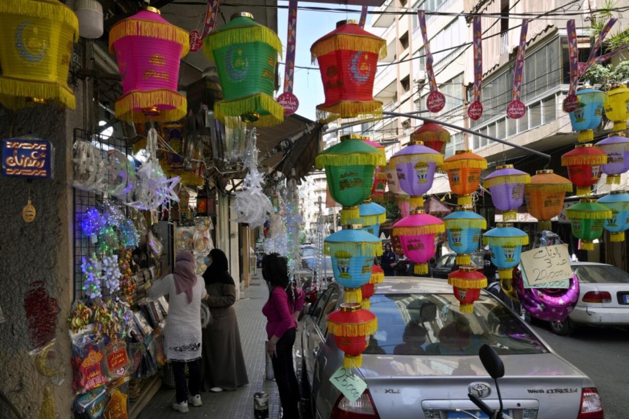 People shop for decorations for the Muslim holy month of Ramadan in Beirut, Lebanon, on April 2. Muslims throughout the world are marking Ramadan, a month of fasting during which observants abstain from food, drink and other pleasures from sunrise to sunset.