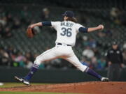 Seattle Mariners starting pitcher Logan Gilbert throws to a Texas Rangers batter during the seventh inning of a baseball game, Wednesday, April 20, 2022, in Seattle. The Mariners won 4-2. (AP Photo/Ted S.