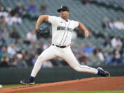 Seattle Mariners starting pitcher Robbie Ray throws to a Texas Rangers batter during the first inning of a baseball game Tuesday, April 19, 2022, in Seattle. (AP Photo/Ted S.