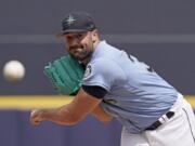 Seattle Mariners starting pitcher Robbie Ray throws during the first inning of a spring training baseball game against the Texas Rangers Monday, March 28, 2022, in Peoria, Ariz.