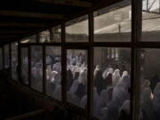 FILE - Women pray in a Shiite mosque during Friday prayers in Kabul, Afghanistan, Friday, Oct. 8, 2021. Afghanistan should join a list of the "worst of the worst" violators of religious freedom in the wake of the Taliban's return to power, a U.S. advisory body is recommending to the State Department in its annual report released on Monday, April 25, 2022.