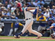 Seattle Mariners' Ty France hits a two-run home run on a pitch from Kansas City Royals starter Carlos Hernandez during the first inning of a baseball game, Sunday, April 24, 2022, in Seattle.