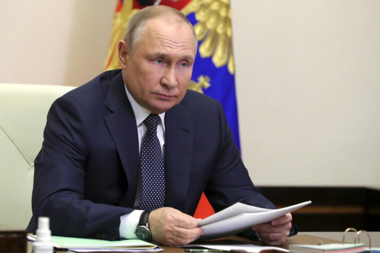 Russian President Vladimir Putin attends a meeting with top officials on support to aviation industry in Russia amid western sanctions vis videoconference at the Novo-Ogaryovo residence outside Moscow, Russia, Thursday, March 31, 2022.