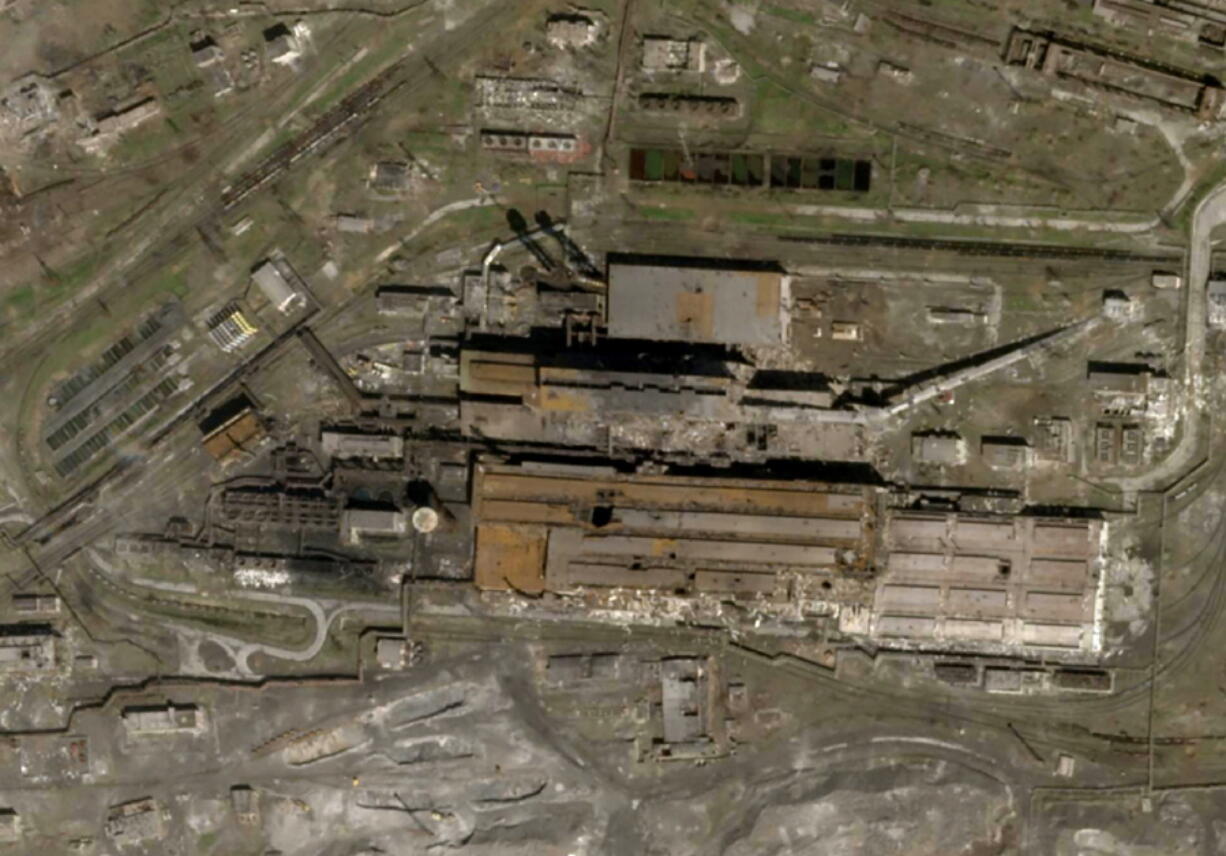 This satellite photo released by Planet Labs and taken on April 20, 2022 shows the Azovstal Steel Plant in Mariupol, Ukraine, with some large holes blasted in the roof.