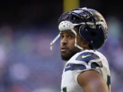 FILE - Seattle Seahawks linebacker Bobby Wagner pauses during the team's NFL football game against the Houston Texans on Dec. 12, 2021, in Houston. Wagner has been informed he is being released by Seattle. Wagner confirmed the news to The Associated Press on Tuesday night, March 8, 2022, hours after the team agreed to trade quarterback Russell Wilson to Denver. Seattle is expected to make Wagner's release official Wednesday.