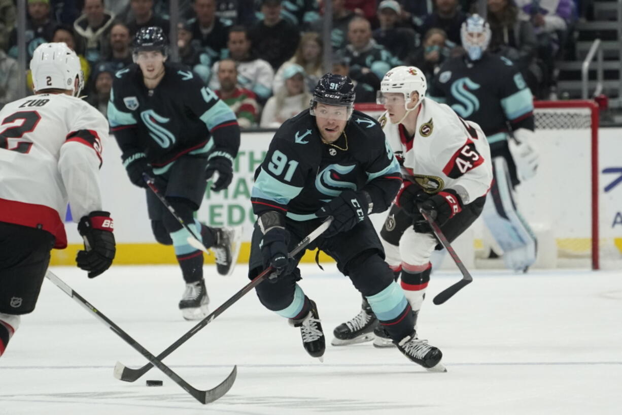 Seattle Kraken right wing Daniel Sprong (91) skates in front of Ottawa Senators left wing Parker Kelly (45) during the second period of an NHL hockey game, Monday, April 18, 2022, in Seattle. (AP Photo/Ted S.