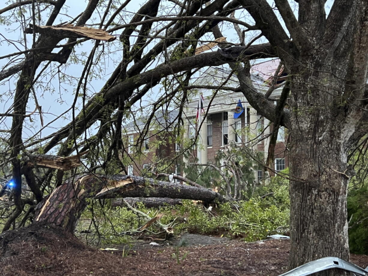 The Bryan County Courthouse was damaged and trees broken in half, Tuesday, April 5, 2022, after a storm passed through the city of Pembroke, Ga., 30 miles from Savannah, Ga. (AP Photo/Lewis M.