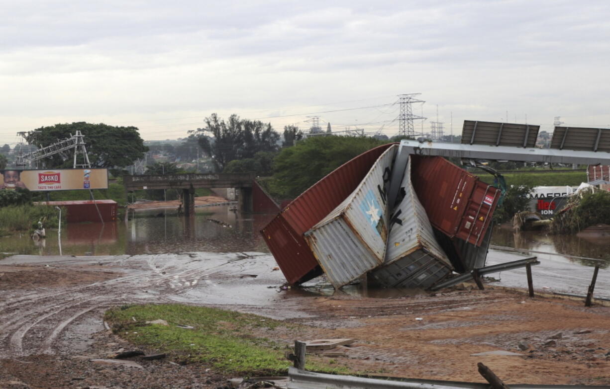 Shipping containers carried away and left in a jumbled pile by floods in Durban, South Africa, Wednesday, April 13, 2022. Flooding in South Africa's Durban area has taken at least 259 lives and is a "catastrophe of enormous proportions," President Cyril Ramaphosa said Wednesday.